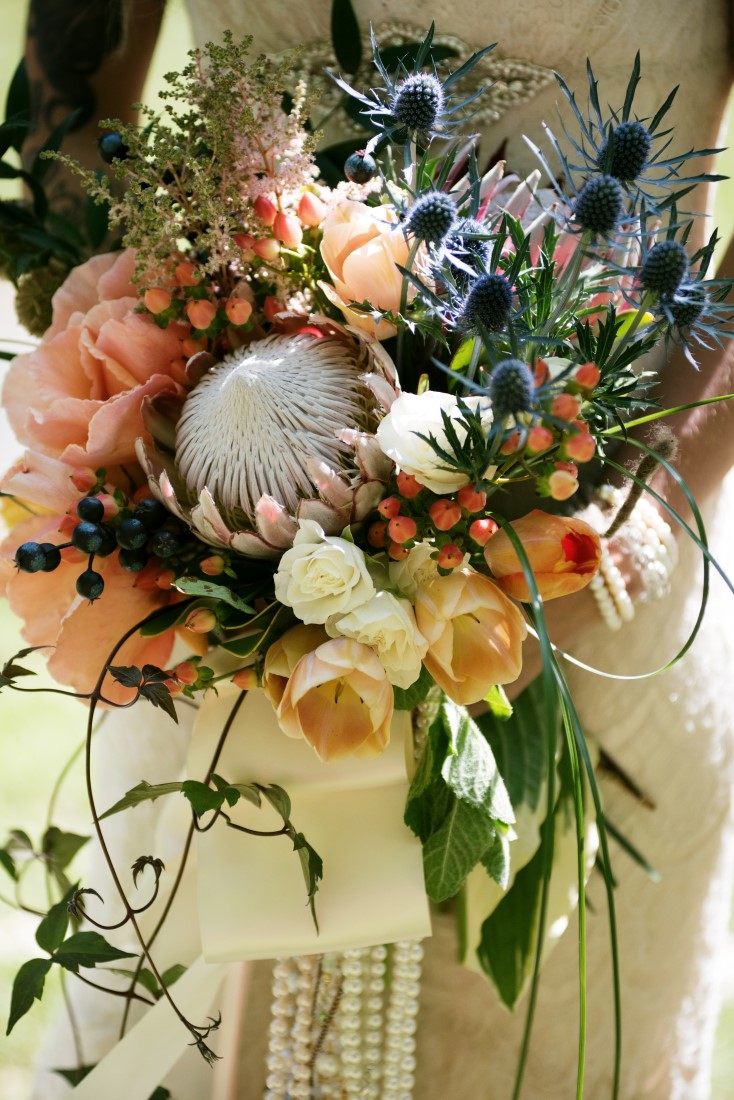 Bride with Bouquet of Protea and Peach Roses Brown's the Florist Victoria Wedding