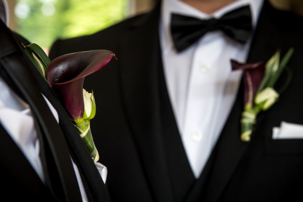 West Coast Weddings Magazine LGBTQ Two Grooms Boutonnieres Dark Calla Lilies