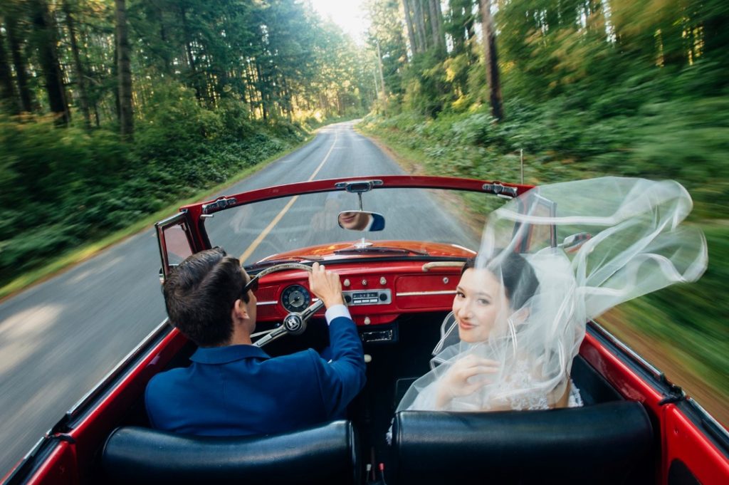 Cover Couple in Red Car West Coast Weddings Magazine