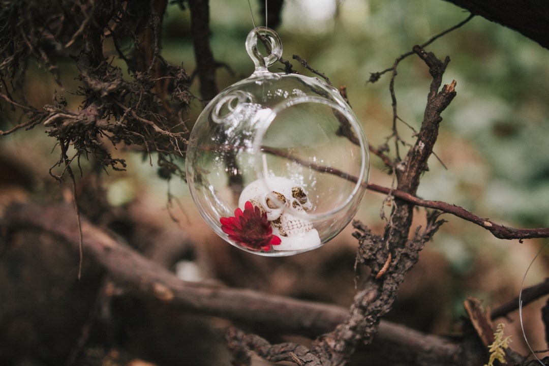 Rose in glass bubble forest ceremony Gothic Dark Elegance West Coast Weddings Magazine