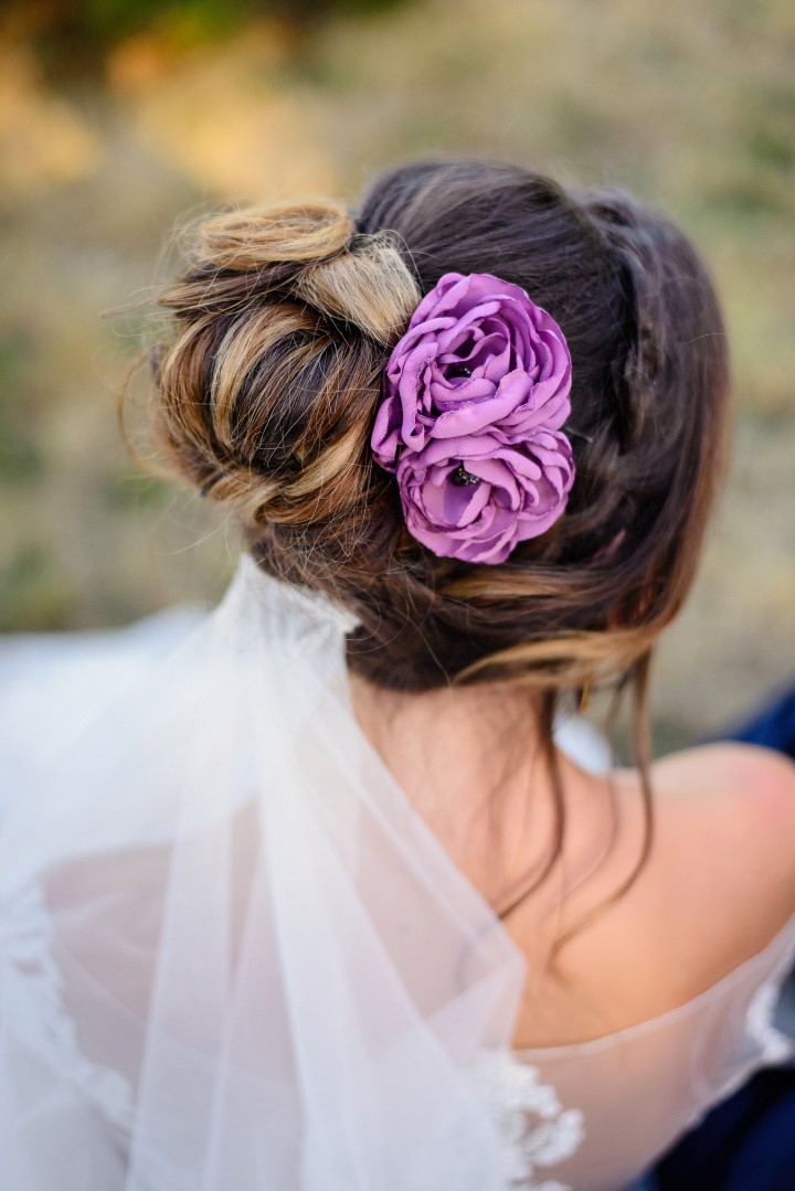 Flowers in brides hair in field of lavender Lace & Lavender Hair Style