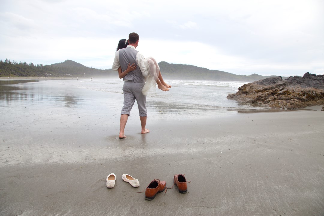 Carrying the Bride Across Beach West Coast Elope Vancouver Island Wedding Magazine