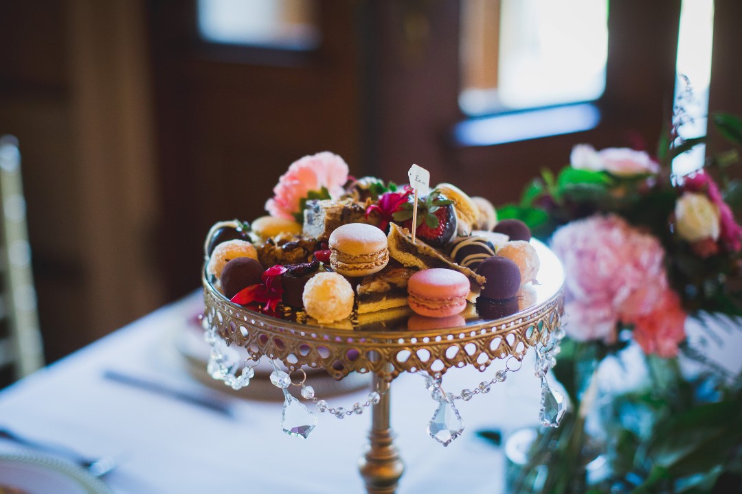 Pastel Coloured MacaroHatley Castle West Coast Weddings Magazinens on Cake Plate