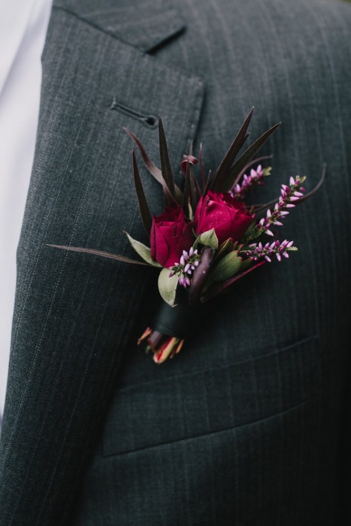 Burgandy Rose boutonniere Fleurtacious by Lynda Marie West Coast Weddings Magazine