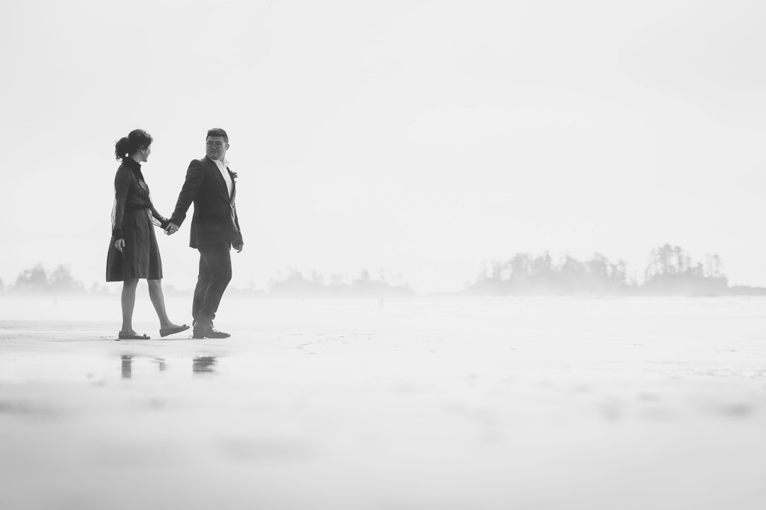 Newlyweds HOlding Hands West Coast Elope Vancouver Island Wedding Magazine