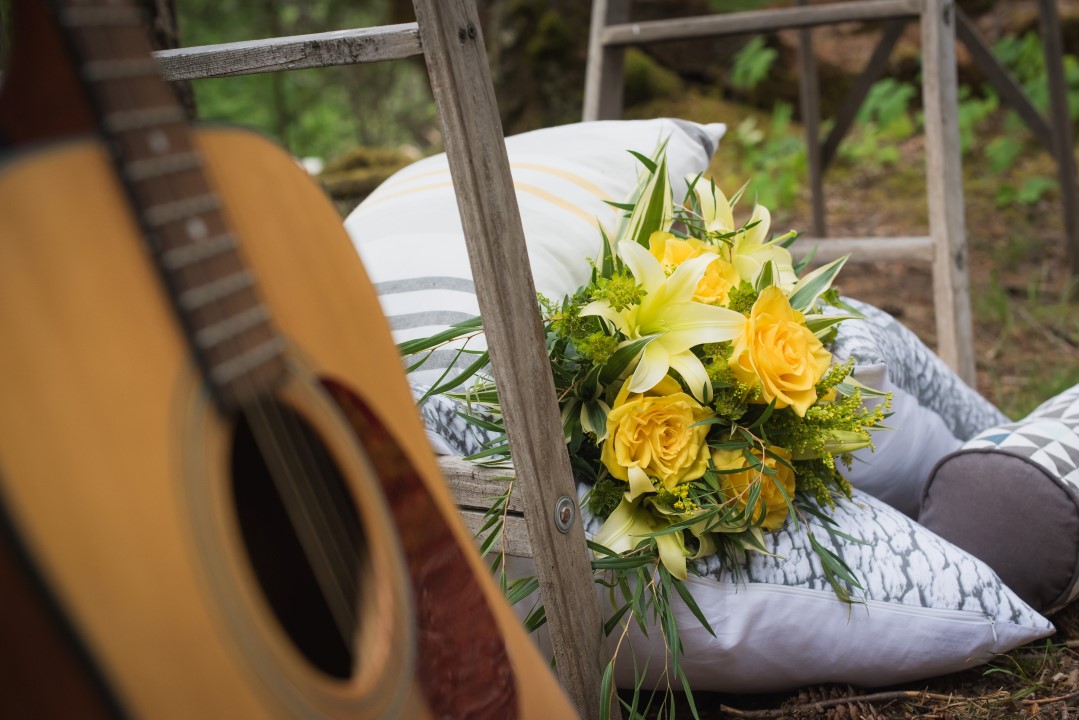 Guitar and Bouquet of Yellow Flowers River Romance Boho Wedding