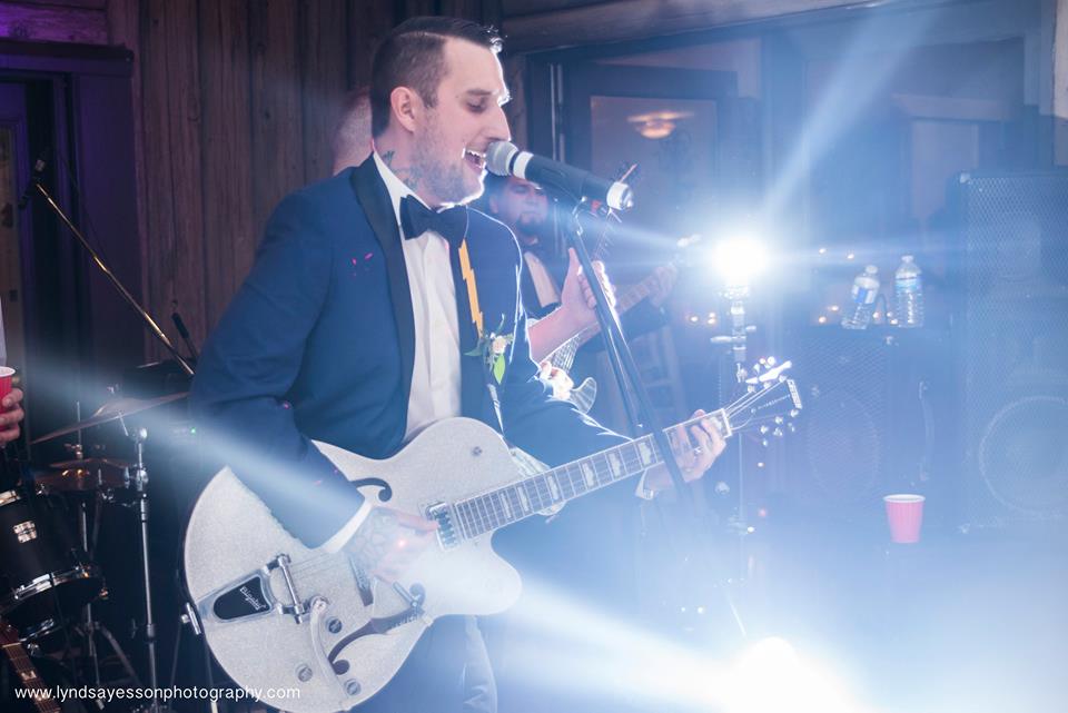 Groom Playing Guitar Ocean View West Coast Weddings Magazine