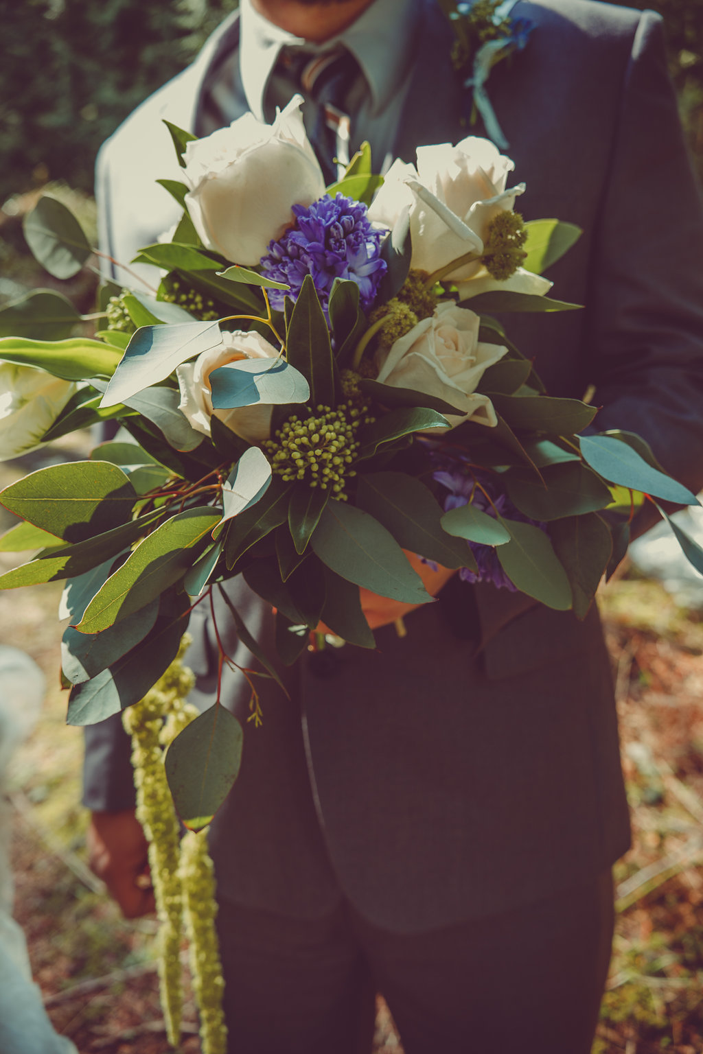 Groom Carrying Bouquet Nanimo West Coast Weddings Magazine