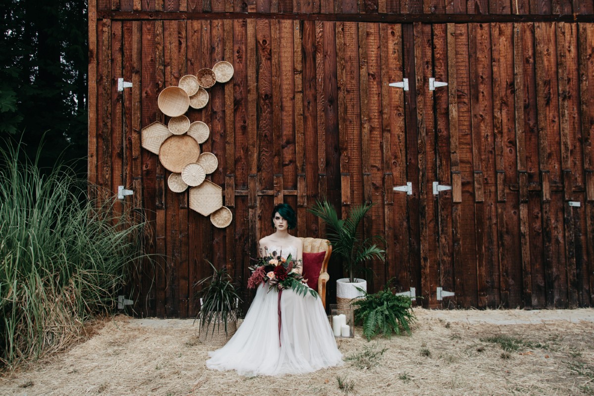 Bride framed by barn Inked + Pretty Brides West Coast Weddings Magazine