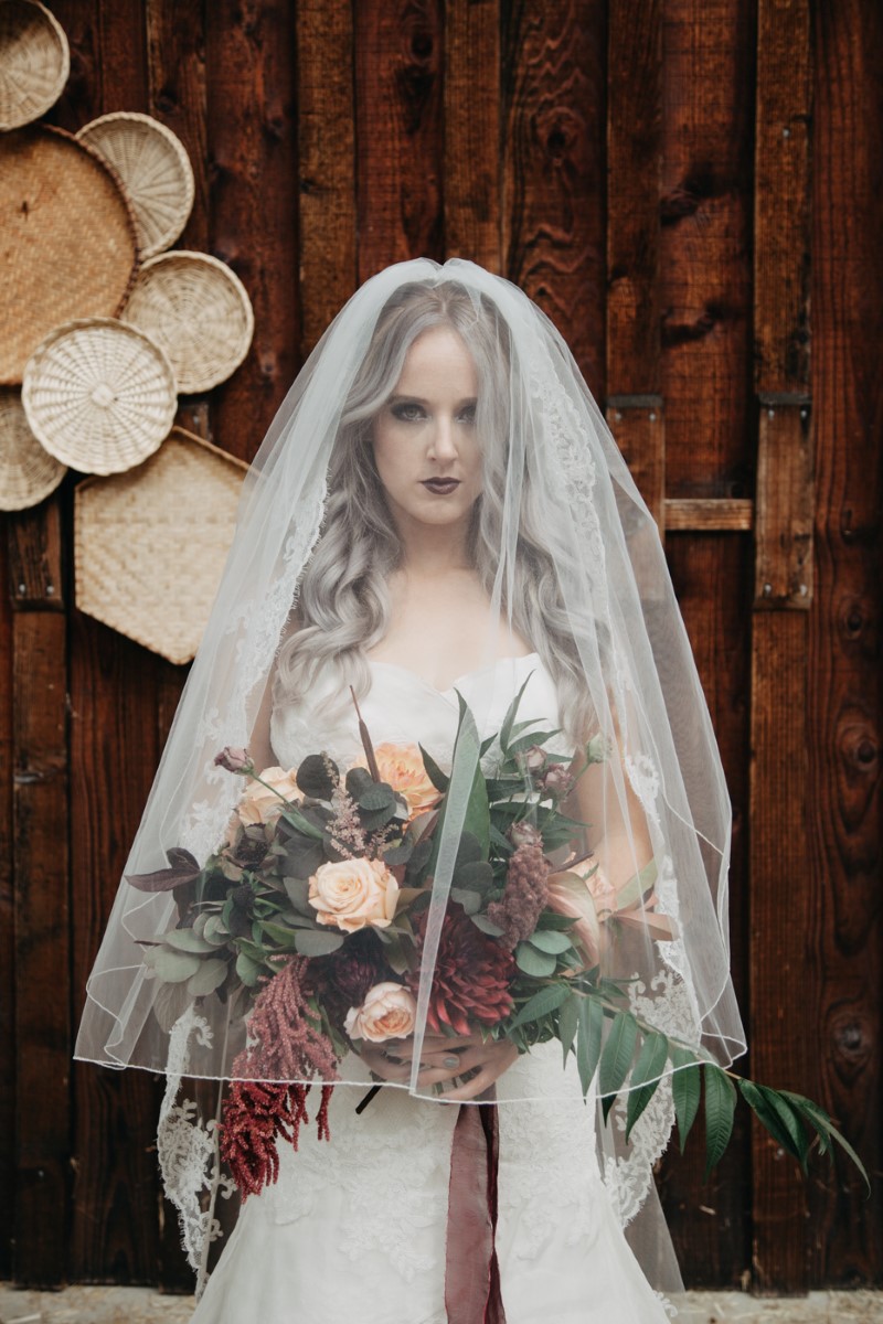 Bride with Veil over face Inked + Pretty Brides West Coast Weddings Magazine