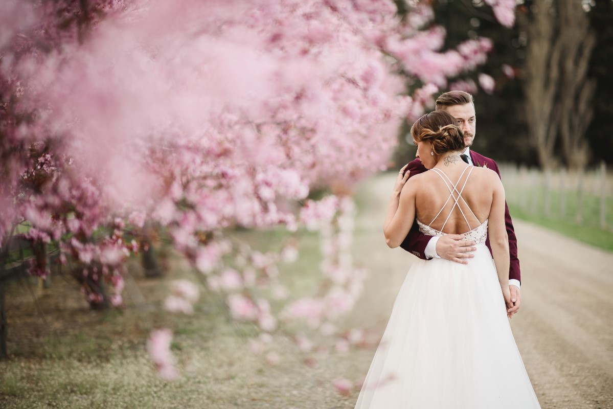 Pink Cherry Blossom Ceremony Circle Arch | Erin Wallis Photography | Sublime Celebrations | Karen Bezaire | Shelter Point Distillery | The White Peony | Jims Clothes Closet | Purely Flower | Headquarters Hair Studio | Eden Street Spa | West Coast Weddings Magazine