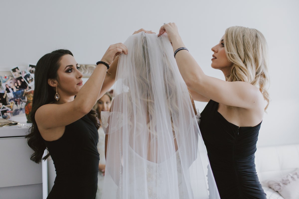 Bridesmaids Put Veil on BrideKayseeb abd Stevan Silk Sophistication Ophelia Photography Vancouver West Coast Weddings Magazine