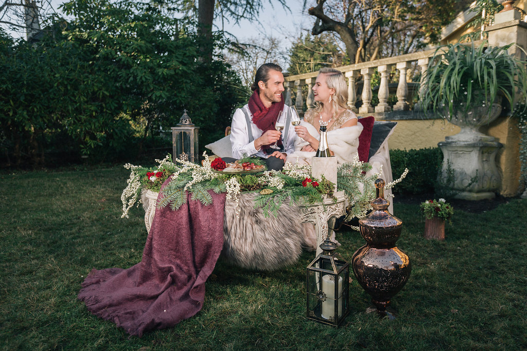 Couple sitting at outdoor decor table West Coast Weddings Magazine