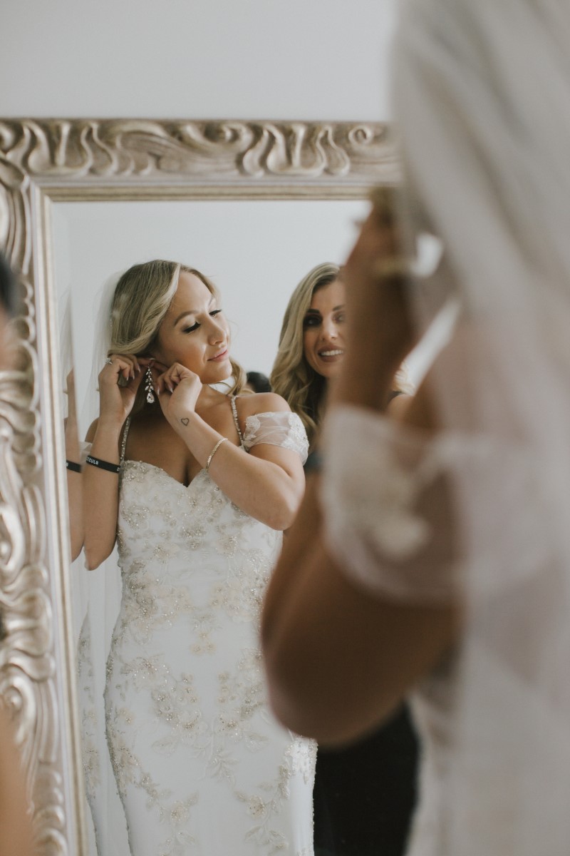 Bride in Mirror Kayseeb abd Stevan Silk Sophistication Ophelia Photography Vancouver West Coast Weddings Magazine