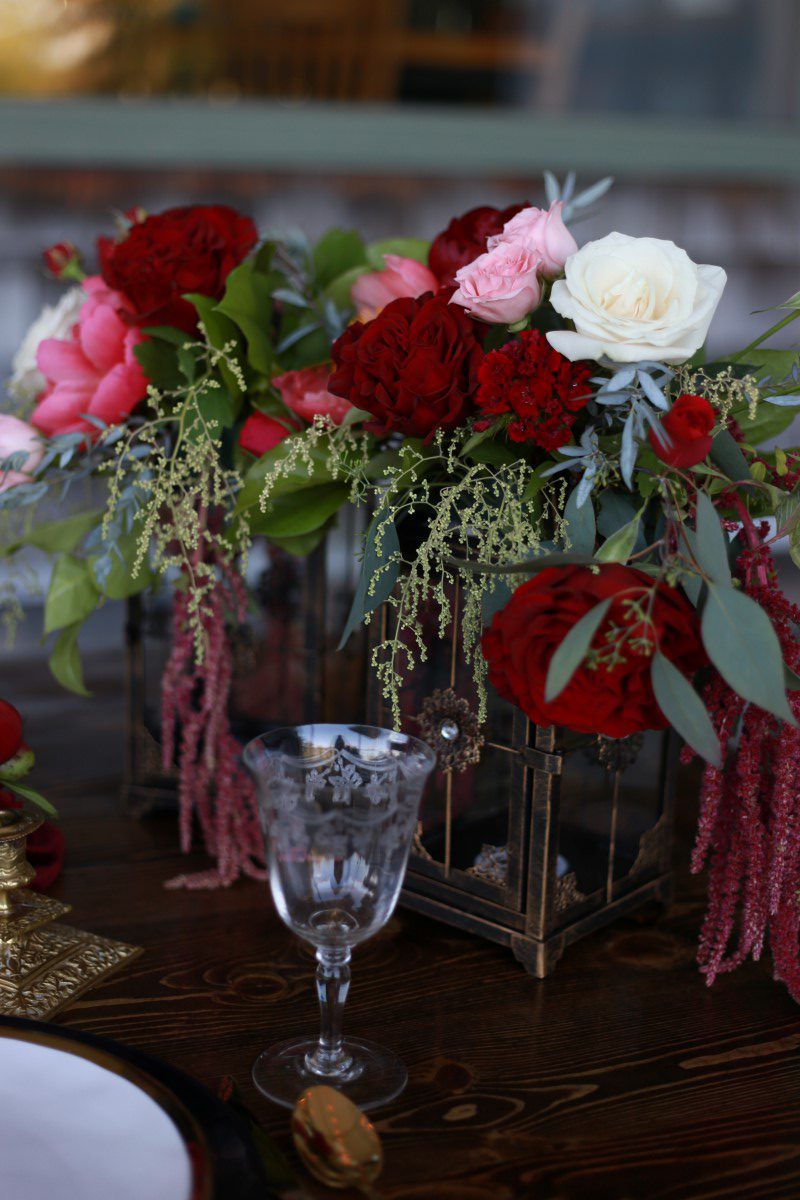 Burgandy Flowers on Champagne Reception Table West Coast Weddings Magazine