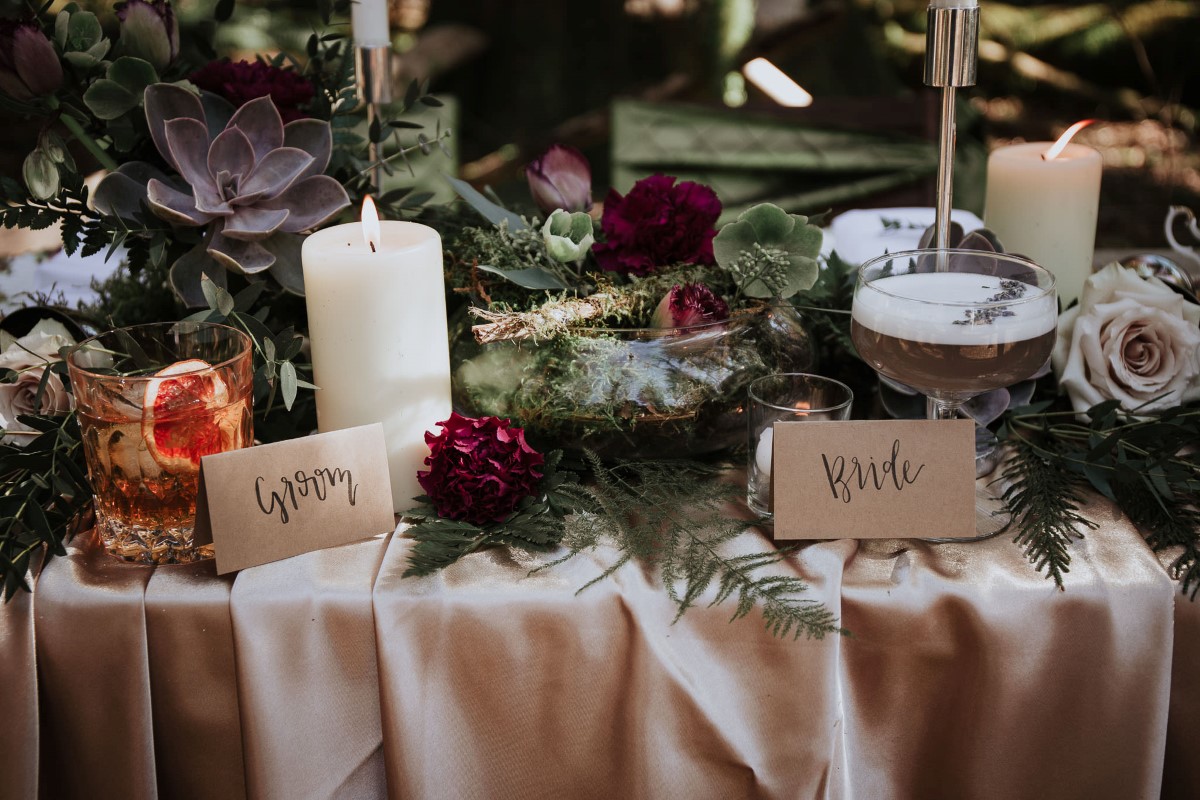 Sun Dappled Candles on Woodland Table by Fierce Florist West Coast Weddings Magazine