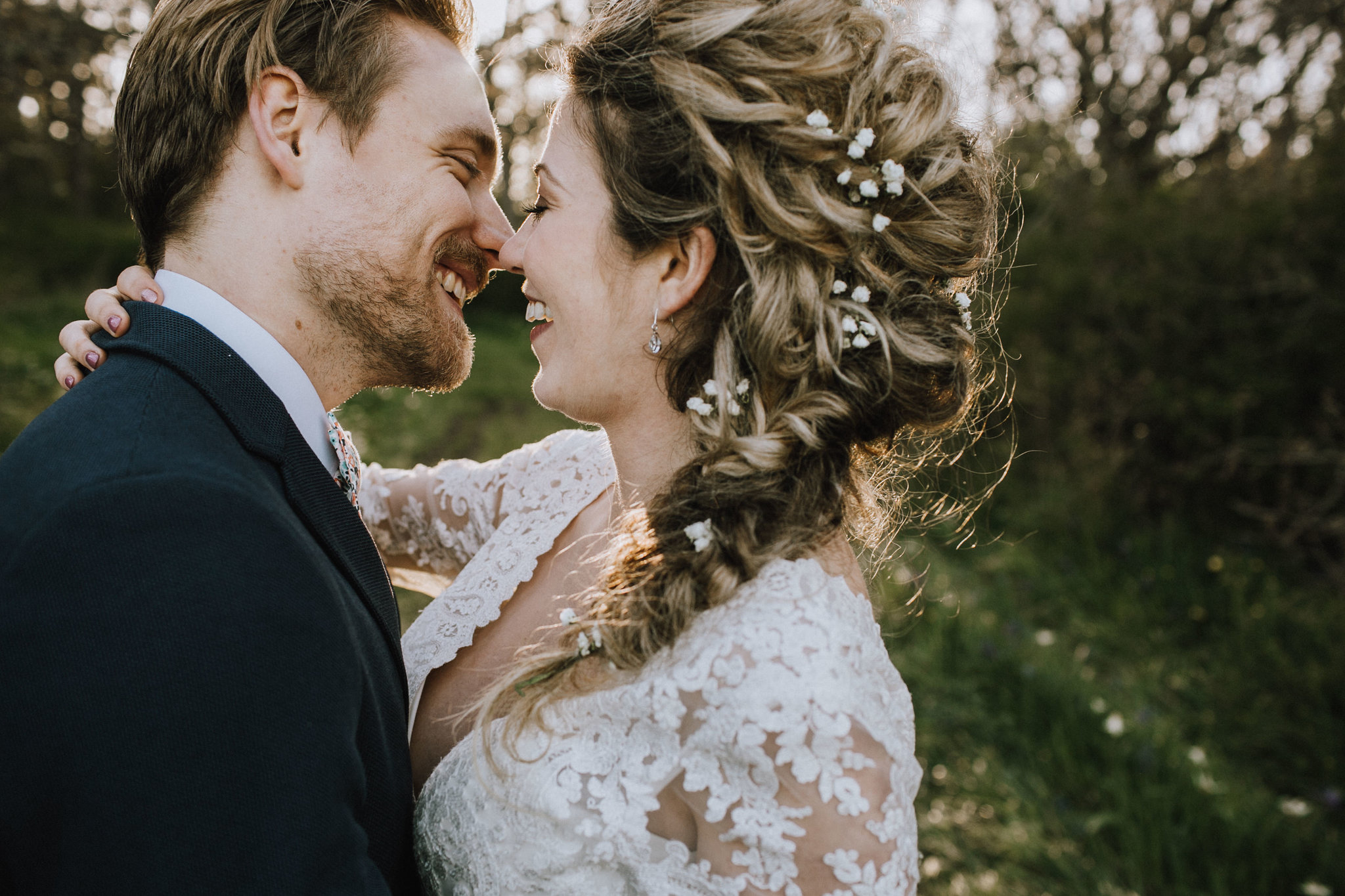 Beach Bridal Session with Couple Kissing Braid in Hair West Coast Weddings Magazine