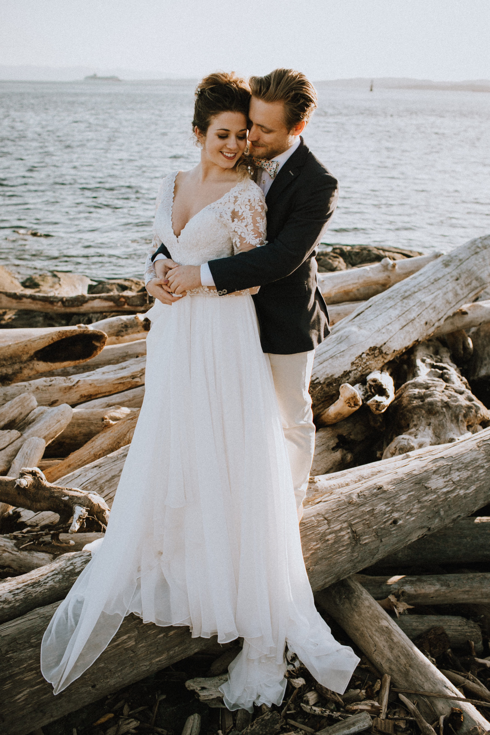 Beach Bridal Session with Wedding Couple on Beach with Driftwood Vancouver Island