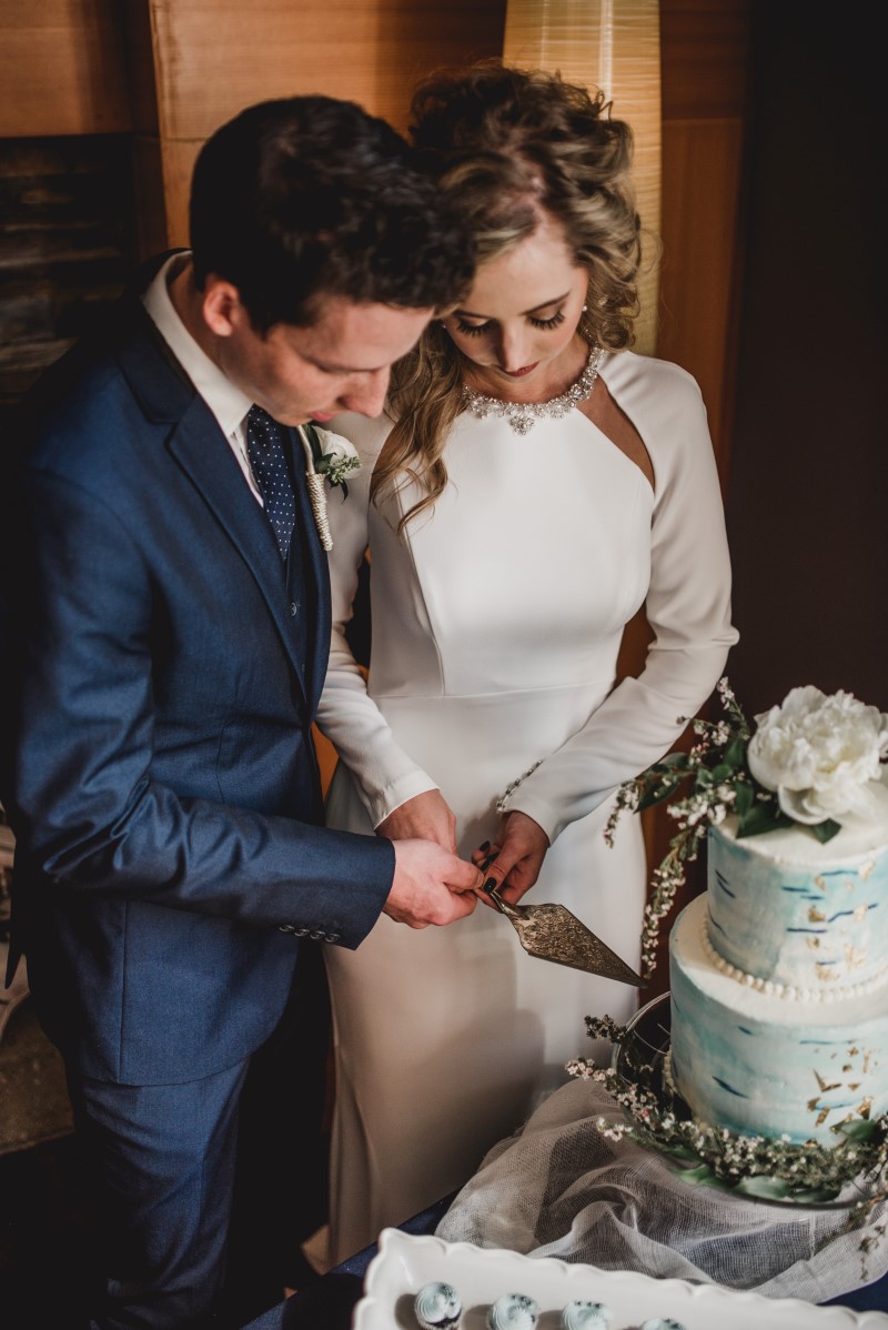 Couple Cutting by Cake by Taryn at Brentwood Bay Resort & Spa on Vancouver Island West Coast Weddings Magazine