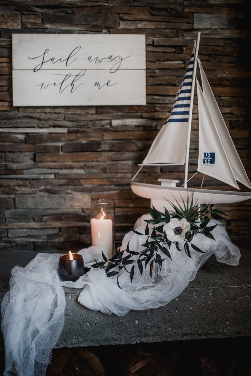 Nautical Reception Theme Sailboat on Guest Table Tulle and Tweed Photography West Coast Weddings Magazine