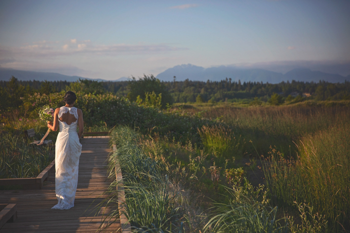 Summer Lace | photos Danielle Wong | gown: Pure Magnolia Gowns | Bouquet: Karen Wazny Designs | Make Up and Hair: NK Beauty| model: Rae | West Coast Weddings Magazine | BC Wedding Magazine Bride in grass