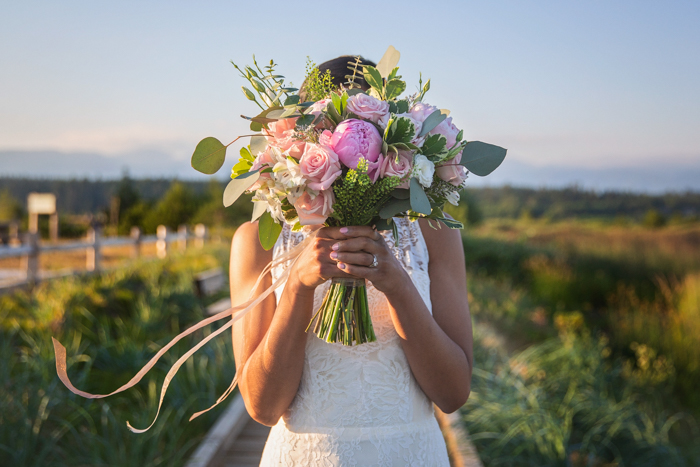 Summer Lace Bride holding Bouquet Karen Wazny Florals Vancouver Wedding Magazine