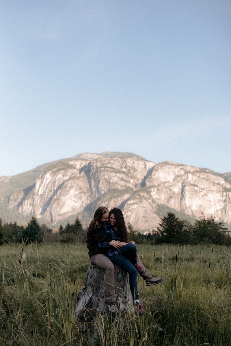 Squamish Engagement Couple with Mountains Behind West Coast Weddings Magazine