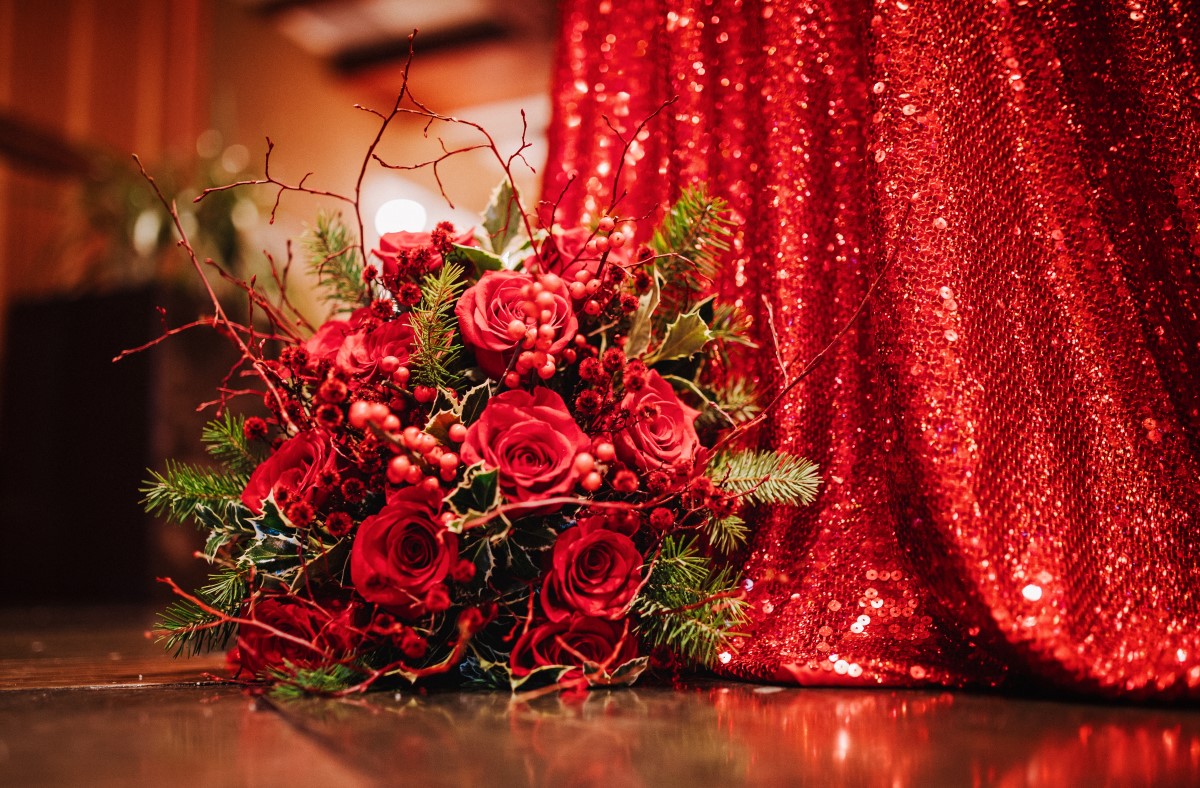 A Glamorous Holiday Wedding Bridal Bouquet Red Roses and Mistletoe