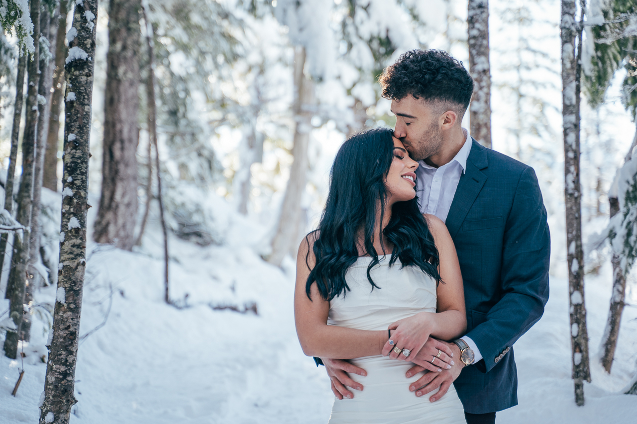 Sea to Sky Winter Dreamscape by Helen Sarah Photography Newlyweds Embrace on Bridge Vancouver Wedding Magazine