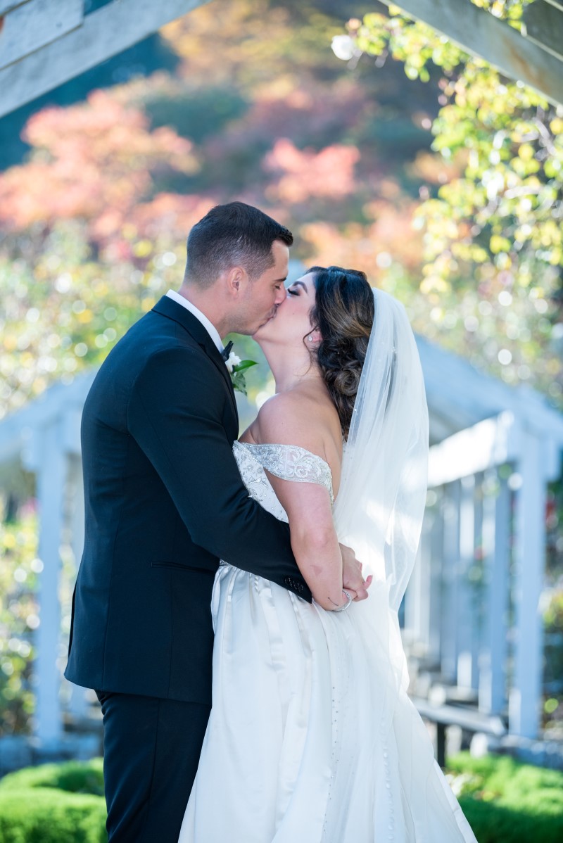 Newlyweds kiss in Vancouver Park