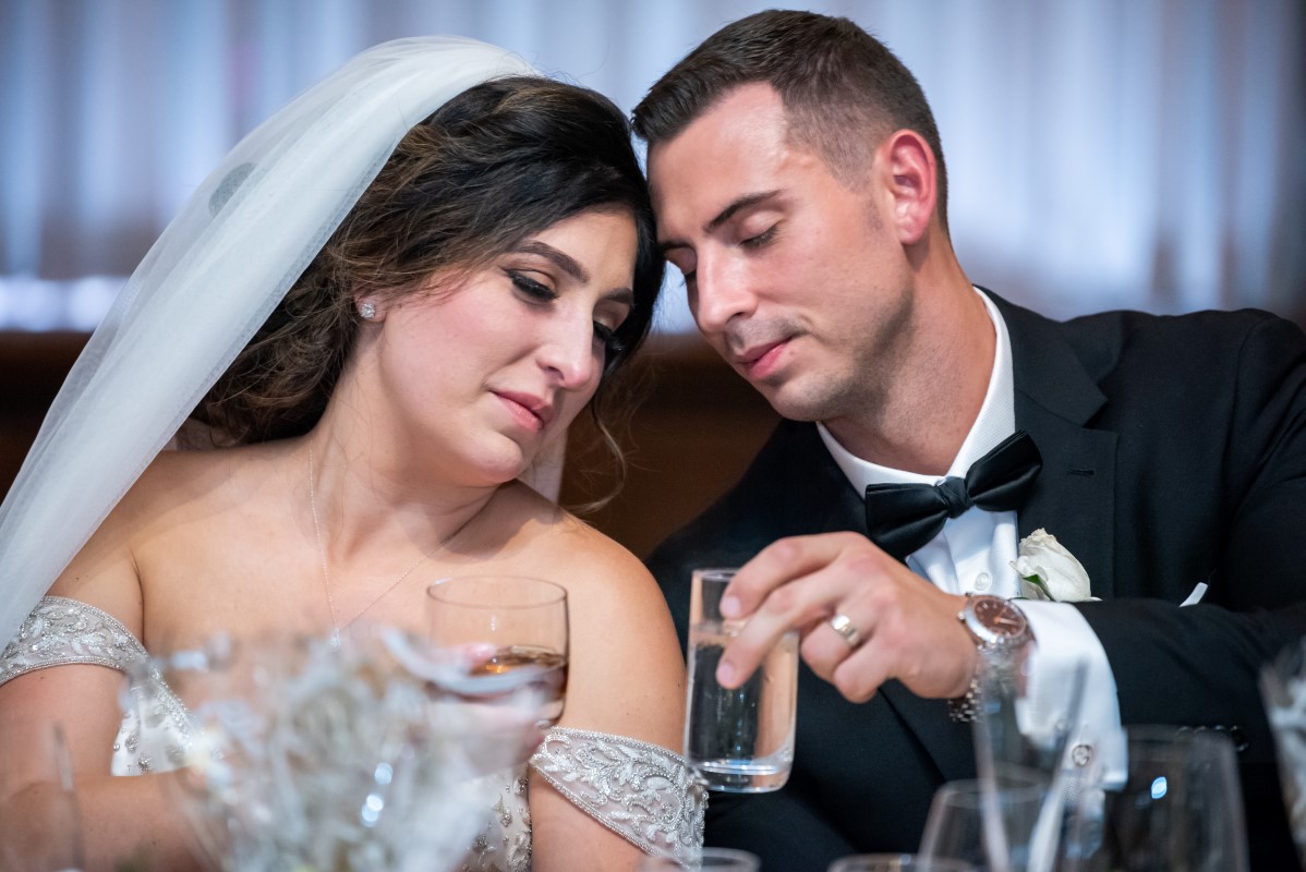 Bride and Groom tender moment at the head table during Vancouver Club reception