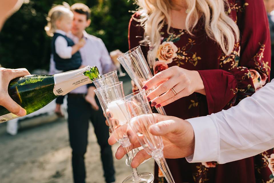 Tofino Elopment drinking champagne on the beach after ceremony West Coast Weddings and Events