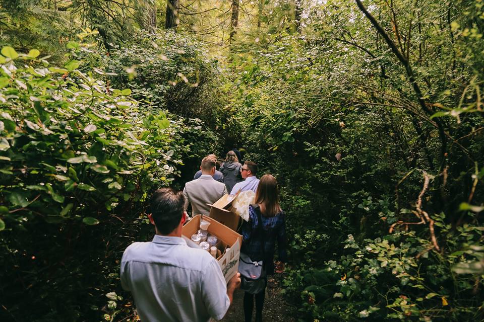 Tofino Elopement friends and family walk towards ceremony on Tonquin Beach Vancouver Island