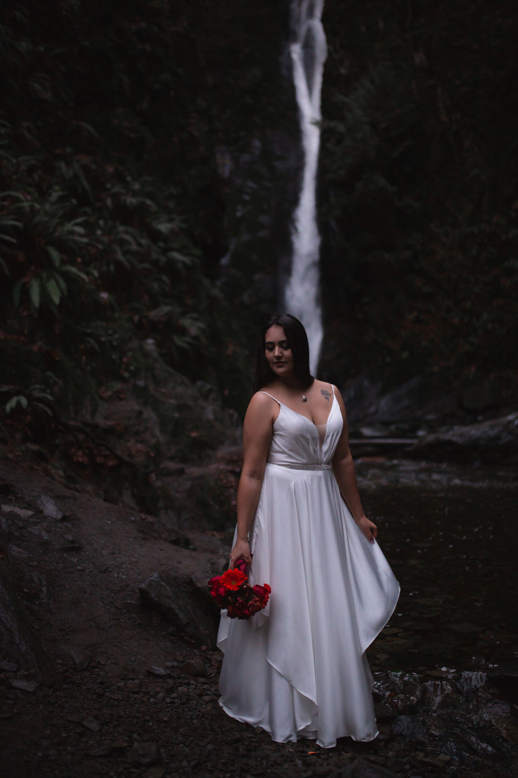 Waterfall Bride with Red floral bouquet