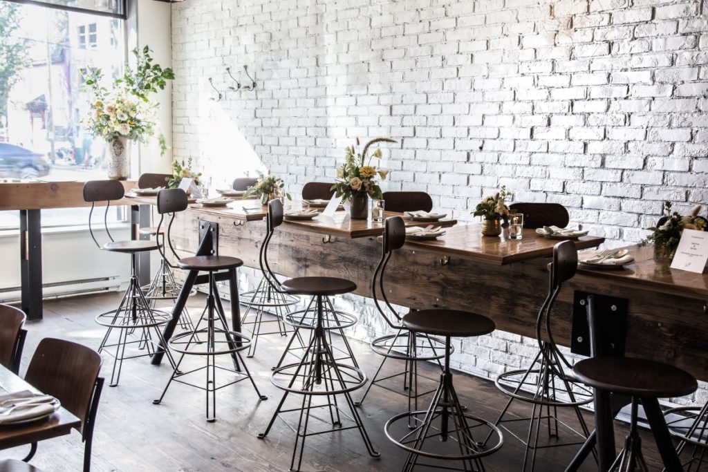 whitewashed brick wall in Vancouver Wedding Venue Burdock & Co