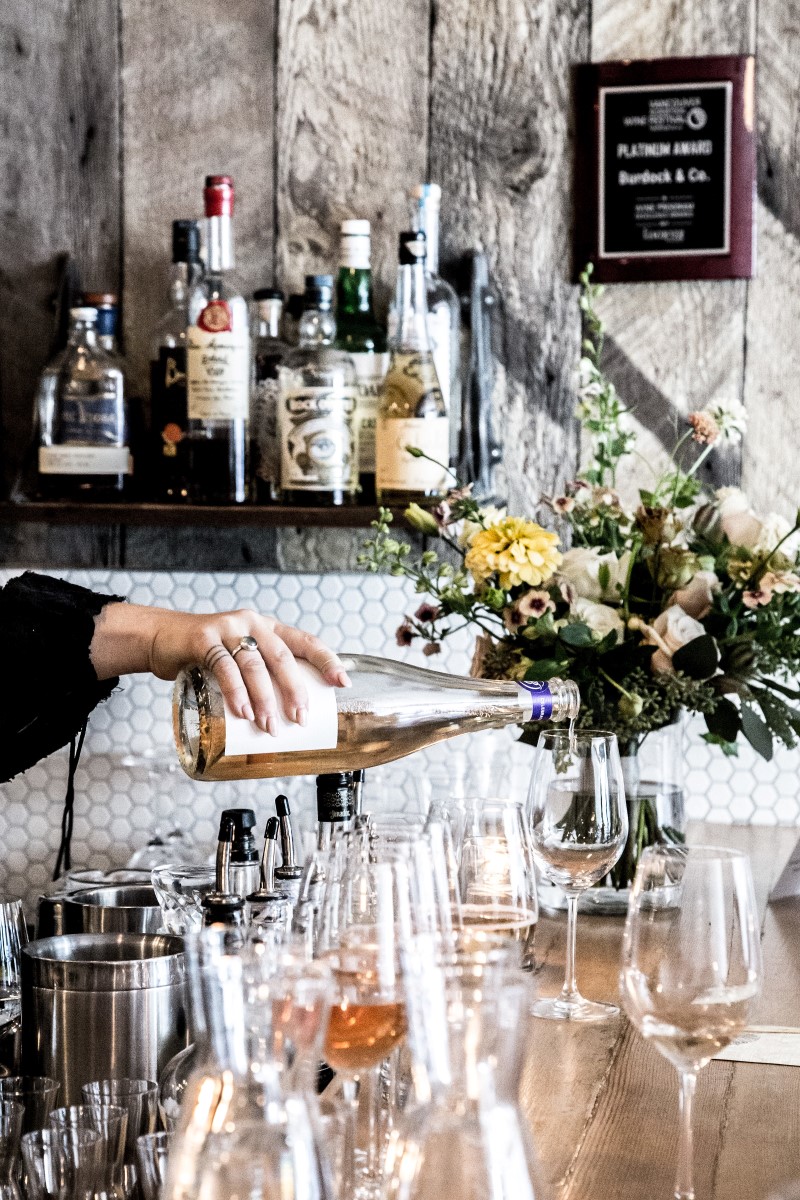 Bar pouring wine at Vancouver Wedding Magazine Venue