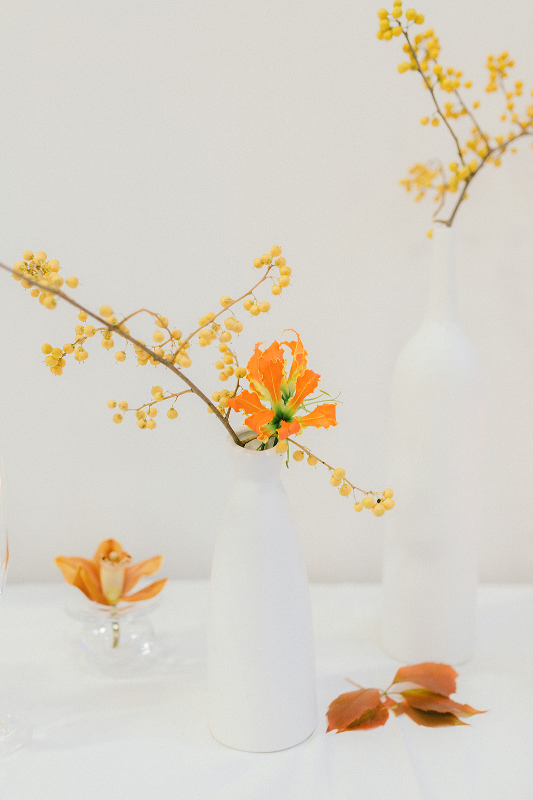 Modern Art Wedding with Orange Flowers on White Reception Table Decor in Vancouver