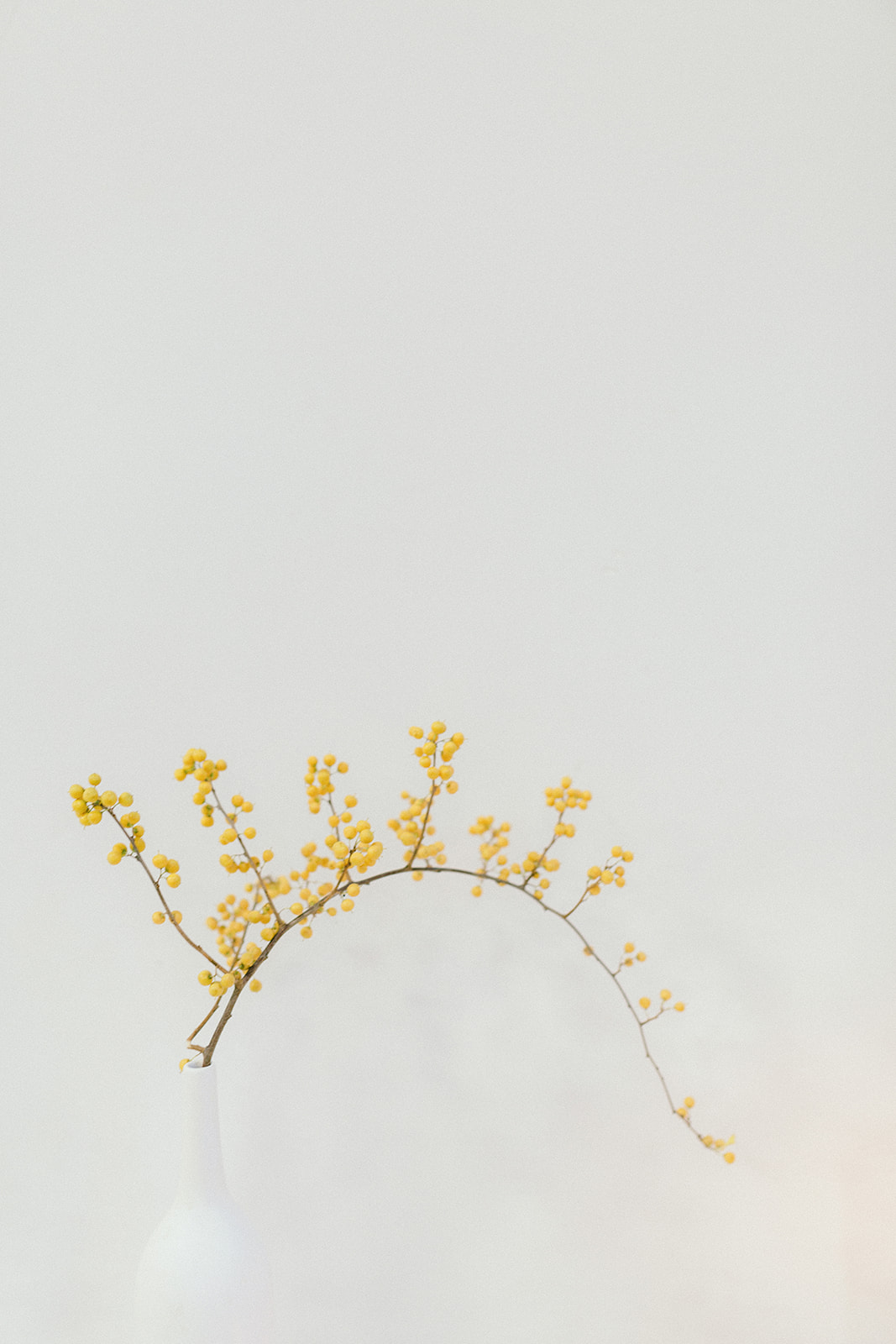 Modern Minimalism Wedding Tableau One orange flower on a white reception table