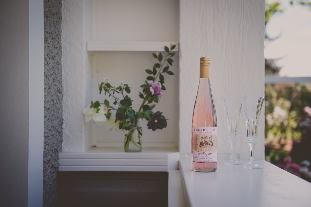 Wine sitting on deck shelf at outdoor wedding Vancouver Island Wedding Magazine