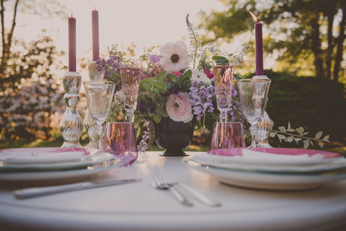 Reception sweetheart table in outdoor garden Maple Bay Manor Vancouver Island