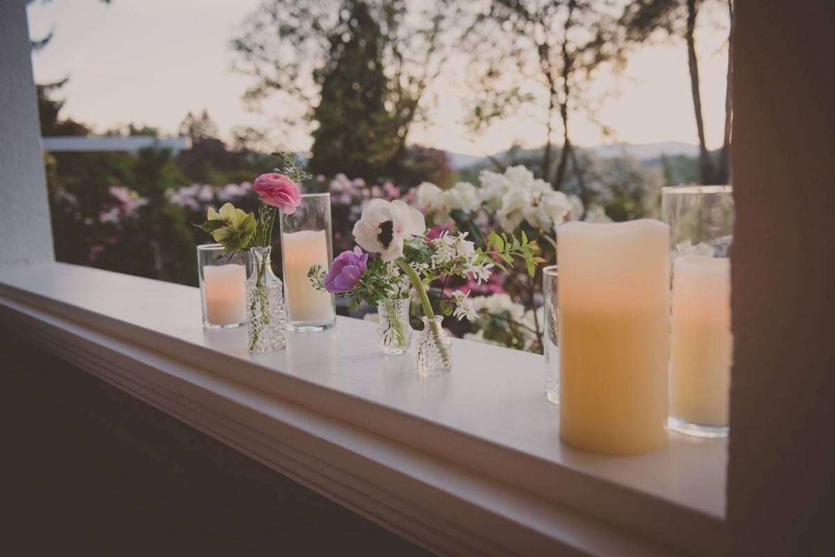 Flowers and drinks along wedding deck West Coast Weddings