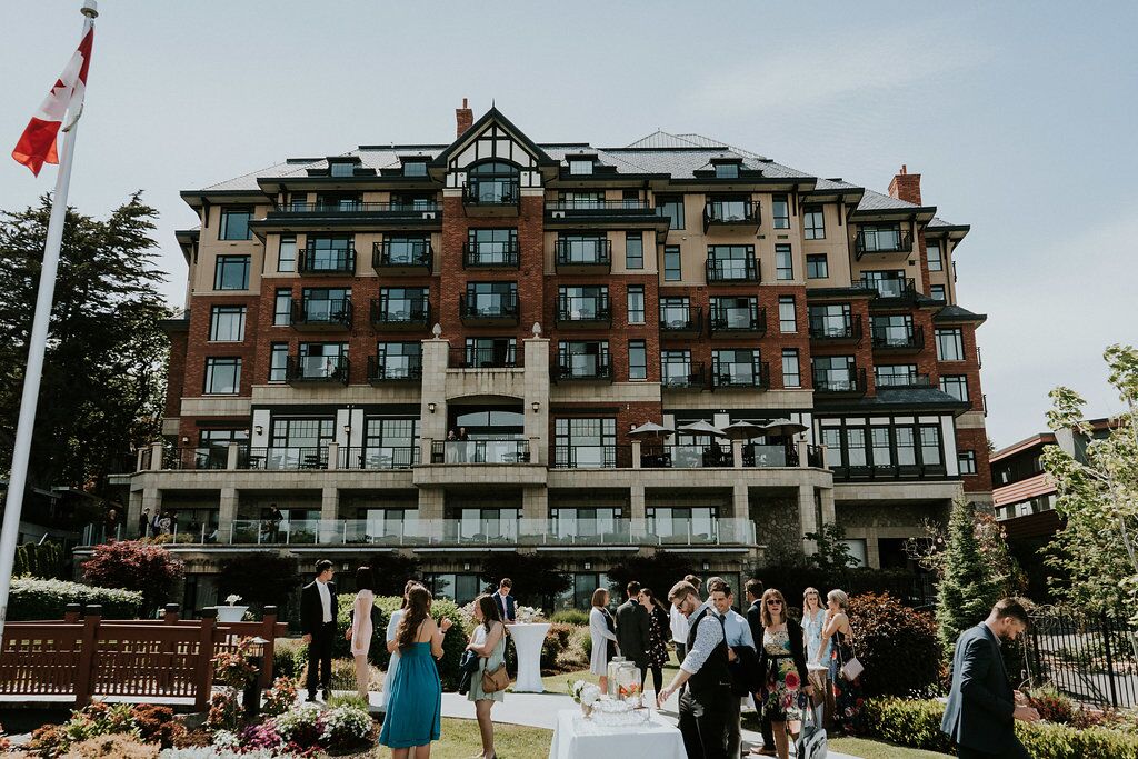 Romantic long shot of wedding ceremony at Oak Bay Beach Hotel on Vancouver Island