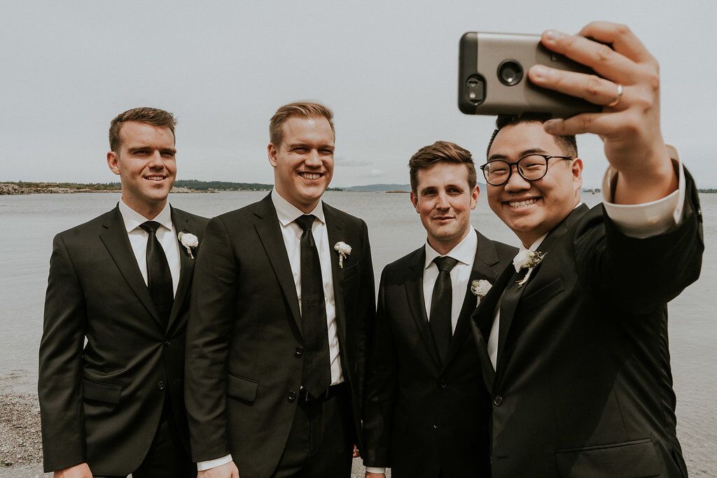 Groomsman take selfie shot together on Vancouver Island wedding