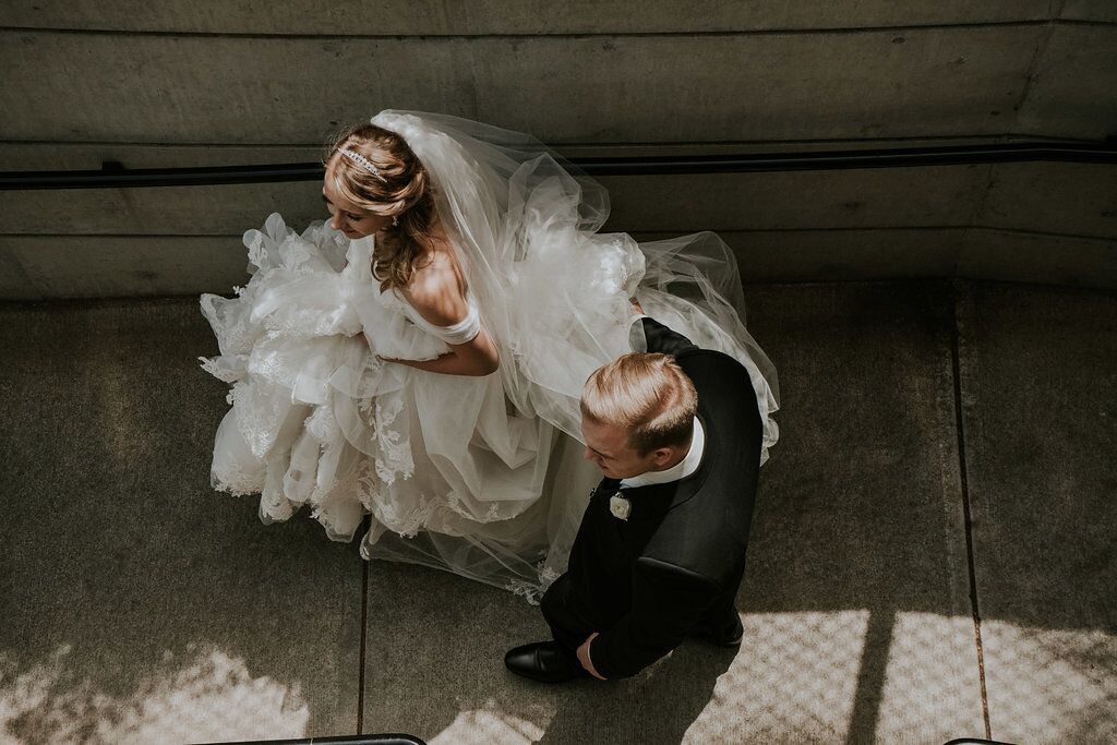 Romantic couple photo as bride and groom go down stairs at Oak Bay Beach Hotel