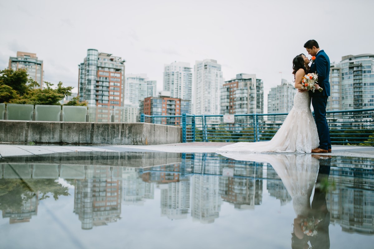 Chinese Wedding couple with Vancouver city line behind them