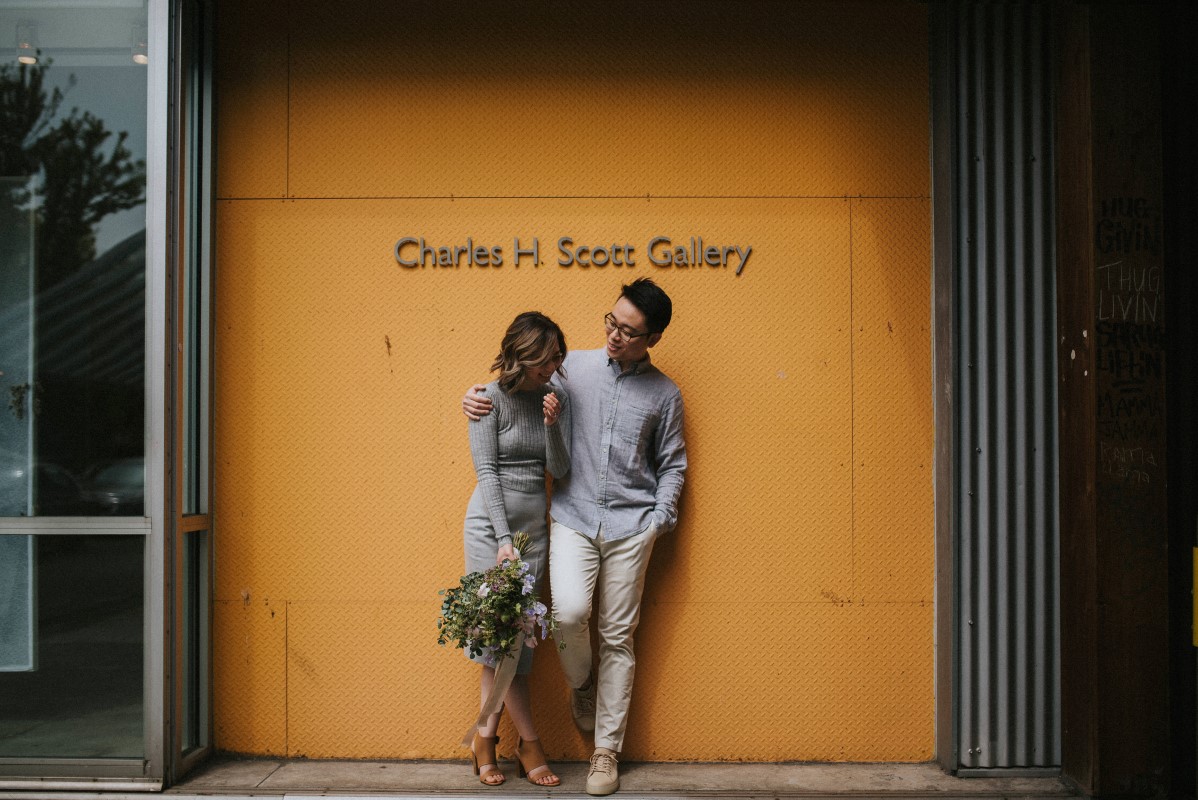 Vancouver Couple pose in front of Charles H Scott Gallery