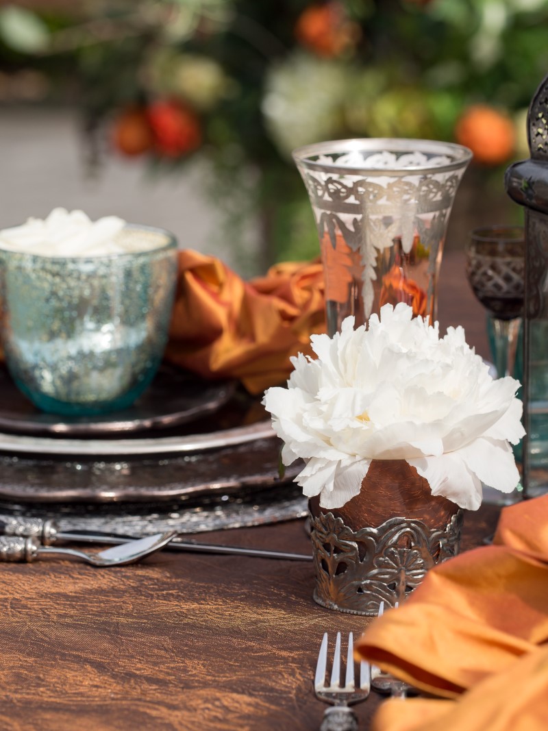 White Peony with Burnt Orange and Pewter Dishes at Poet's Cove Resort & Spa