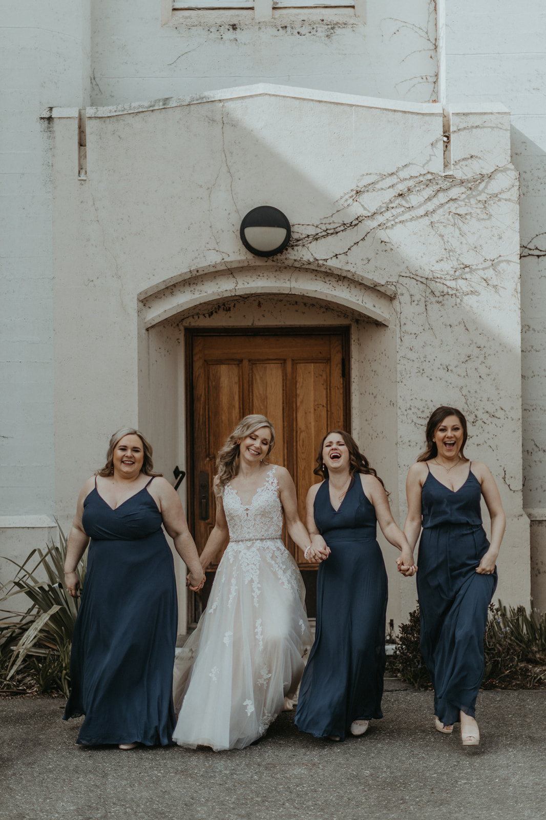 Bride and her bridesmaids wear gowns by Blush Victoria on Vancouver Island