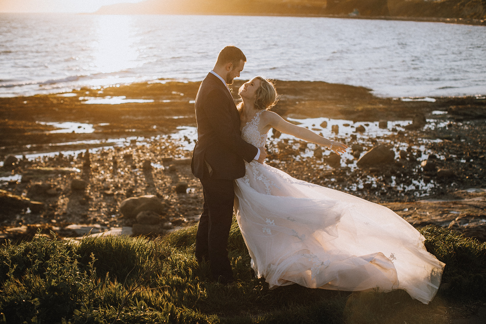 Newlyweds on the beach at sunset on Vancouver Island by Secret Waters Photography