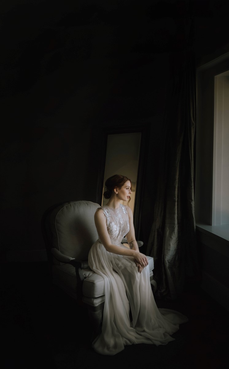 Sophisticated Bridal Portrait in front of window West Coast Weddings Magazine